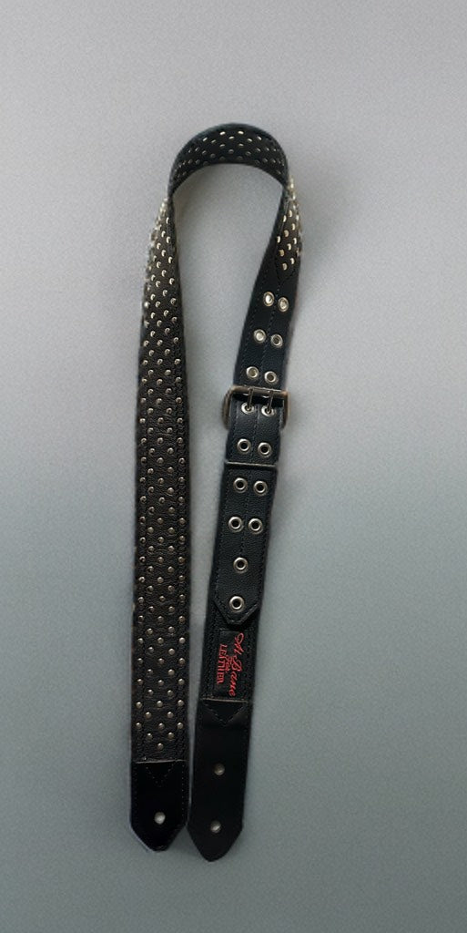 &nbsp;Designed for the guitarist who thrives on intensity, this strap is crafted from premium, full-grain leather and adorned with bold metal rivets, creating a look that’s both rugged and stylish. Its robust construction ensures long-lasting durability, while the adjustable length ( 50"- 61")and premium quality leather provide unparalleled comfort during extended performances.